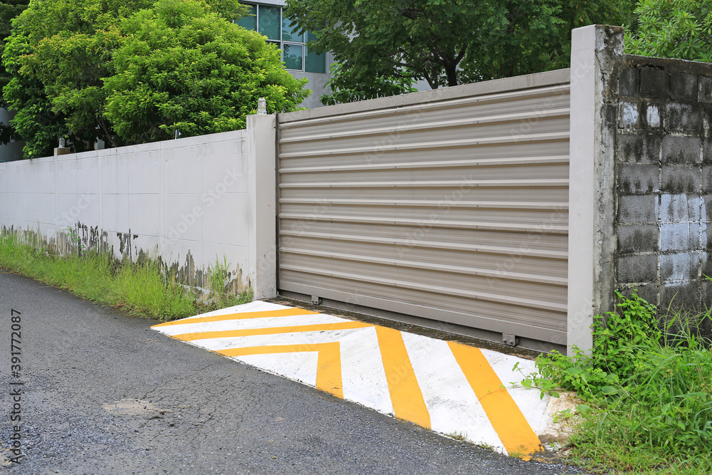 Metal roller garage entrance door of building. Metal roller garage entrance door of building.