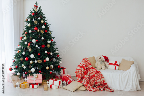 New Year's background Christmas tree with gifts interer decor photo