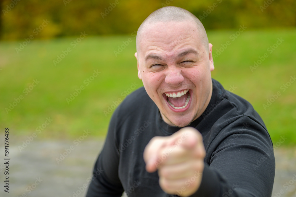 Young man laughing or shouting at the camera Young man laughing or shouting at the camera