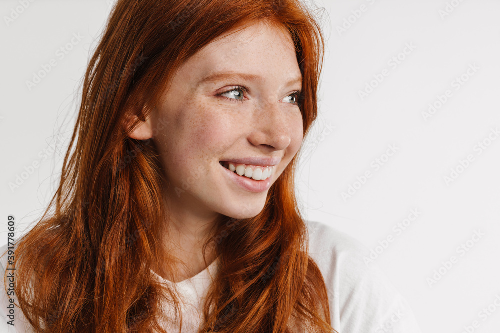 Ginger beautiful happy girl smiling and looking aside Ginger beautiful happy girl smiling and looking aside