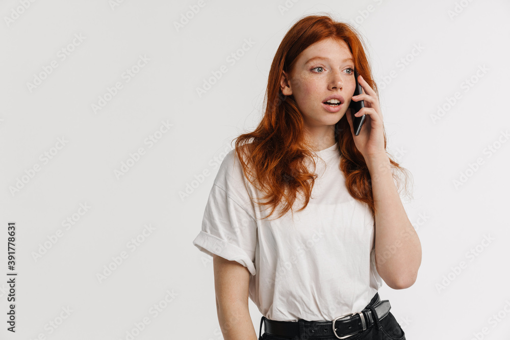 Ginger beautiful surprised girl talking on cellphone Ginger beautiful surprised girl talking on cellphone