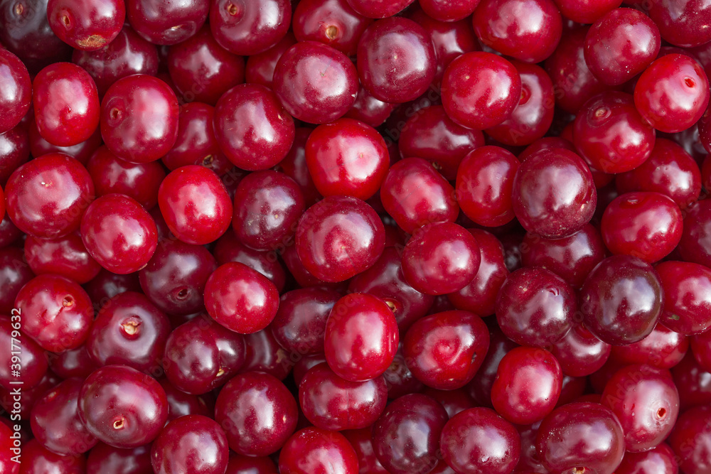 Red cherry berries close-up. Natural background from berries. Red cherry berries close-up. Natural background from berries.
