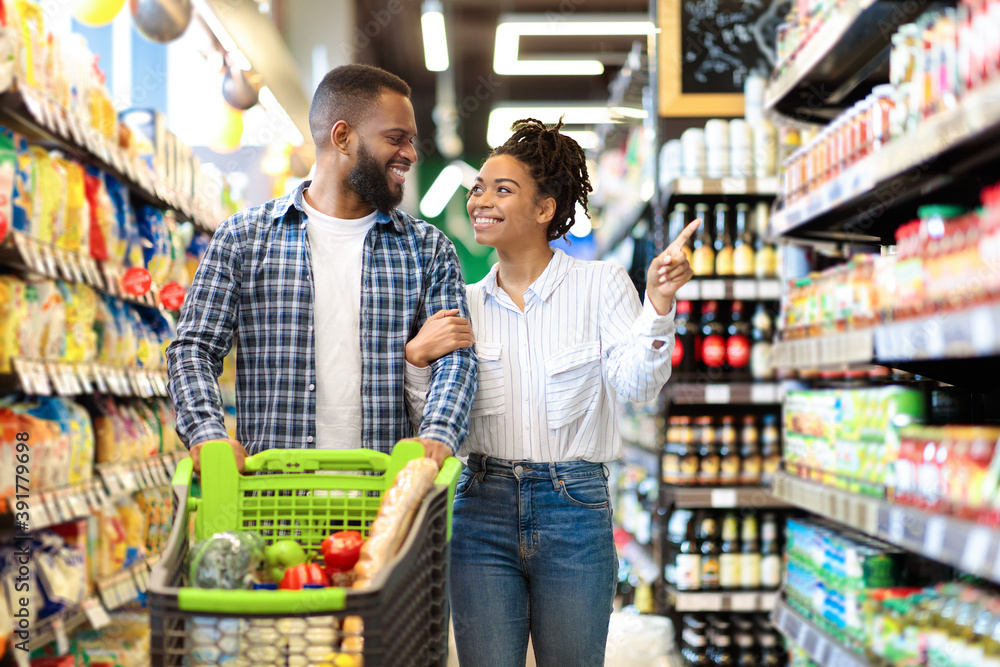 African Family Couple Shopping In Supermarket Buying Groceries Indoor