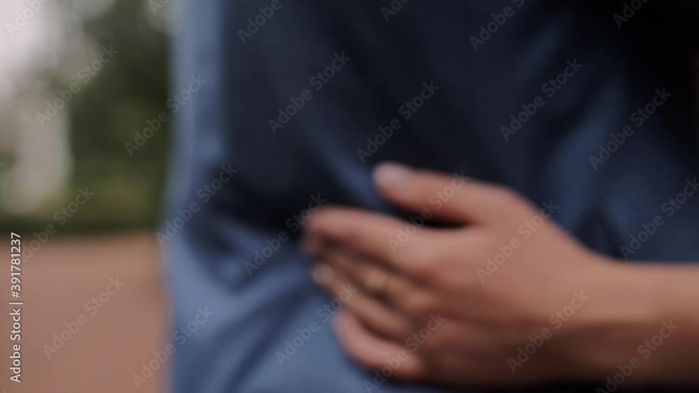 bride's hand on the groom's jacket with a ring bride's hand on the groom's jacket with a ring