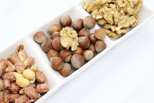 shelled hazelnuts, walnuts and salted peanuts, mixed nuts.
