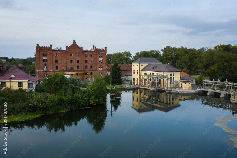 Aerial view of the small hydroelectric power plant on the Angrapa river in Ozersk, Kaliningrad, Russia