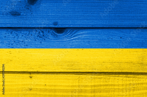 Wallpaper Mural Ukraine flag painted on old wood plank background. Brushed natural light knotted wooden board texture. Wooden texture background flag of Ukraine Torontodigital.ca