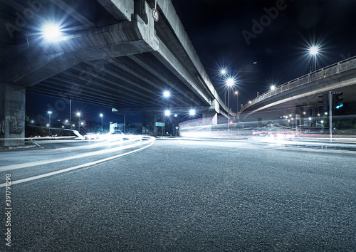 Freeway in night with cars light in crossroads