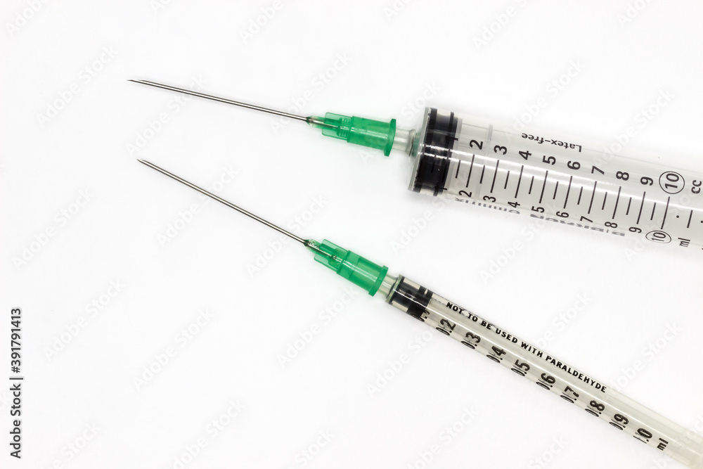 Hypodermic needles on a white background. Shringes for vaccination during the coronavirus pandemic Hypodermic needles on a white background. Shringes for vaccination during the coronavirus pandemic