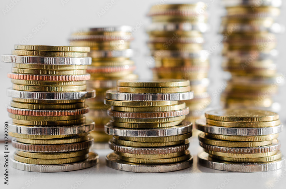 row of coin stack growing pile on white background for money saving and investment business financial and banking concept. row of coin stack growing pile on white background for money saving and investment business financial and banking concept.