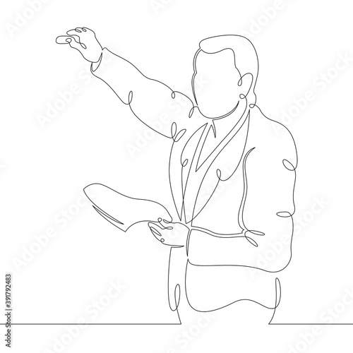 Scientist professor teacher stands writes on the student board