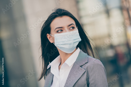 Photo of minded pretty businesswoman wear medical mask formalwear jacket employee in quarantine in outdoors
