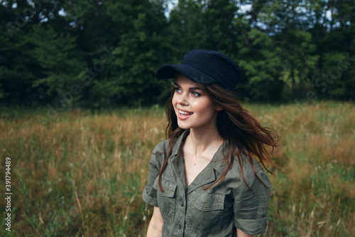  woman in blue cap outdoors in the meadow and fresh air