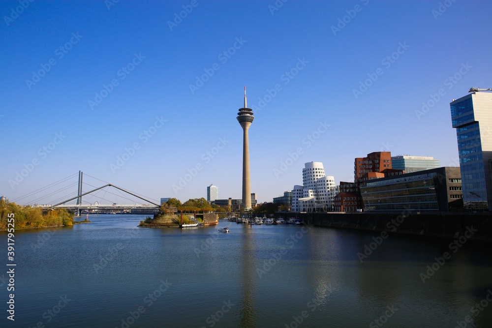 Dusseldorf (Medienhafen), Germany - November 7. 2020: View over river on television tower,  buildings with modern futuristic architecture design