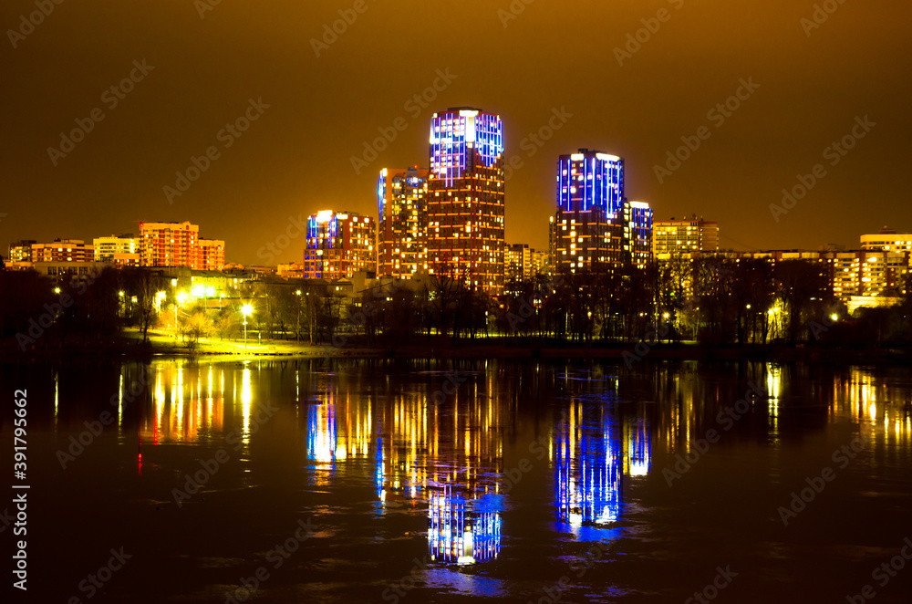 Fototapeta premium Yekaterinburg.Residential area on the banks of the Iset river at night.