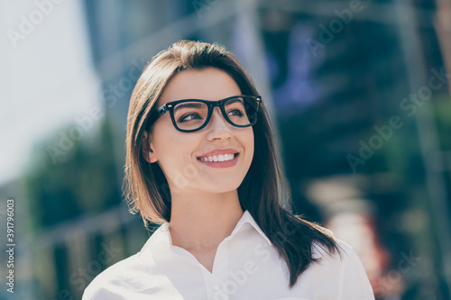 Photo of sweet pretty young lady dressed white formal shirt arm glasses looking side outside