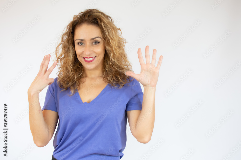Beautiful young woman wearing casual clothes showing and pointing up with fingers number eight while smiling confident and happy.