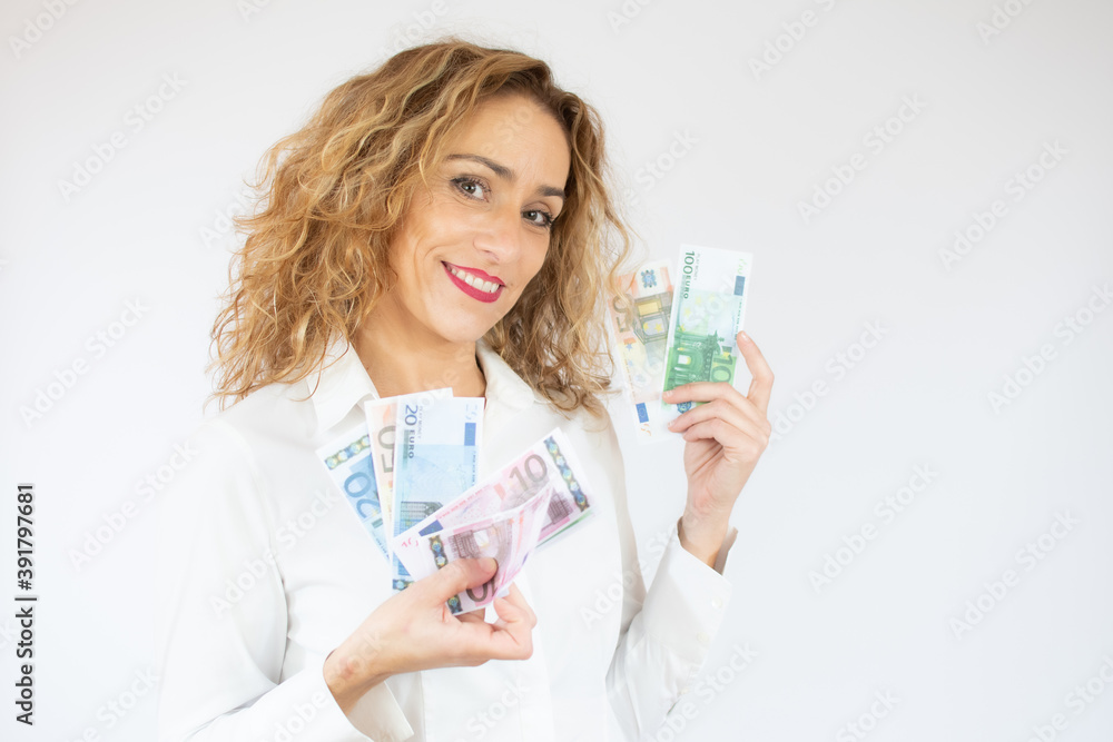 Portrait of a cheerful woman holding money banknotes isolated over white background Portrait of a cheerful woman holding money banknotes isolated over white background