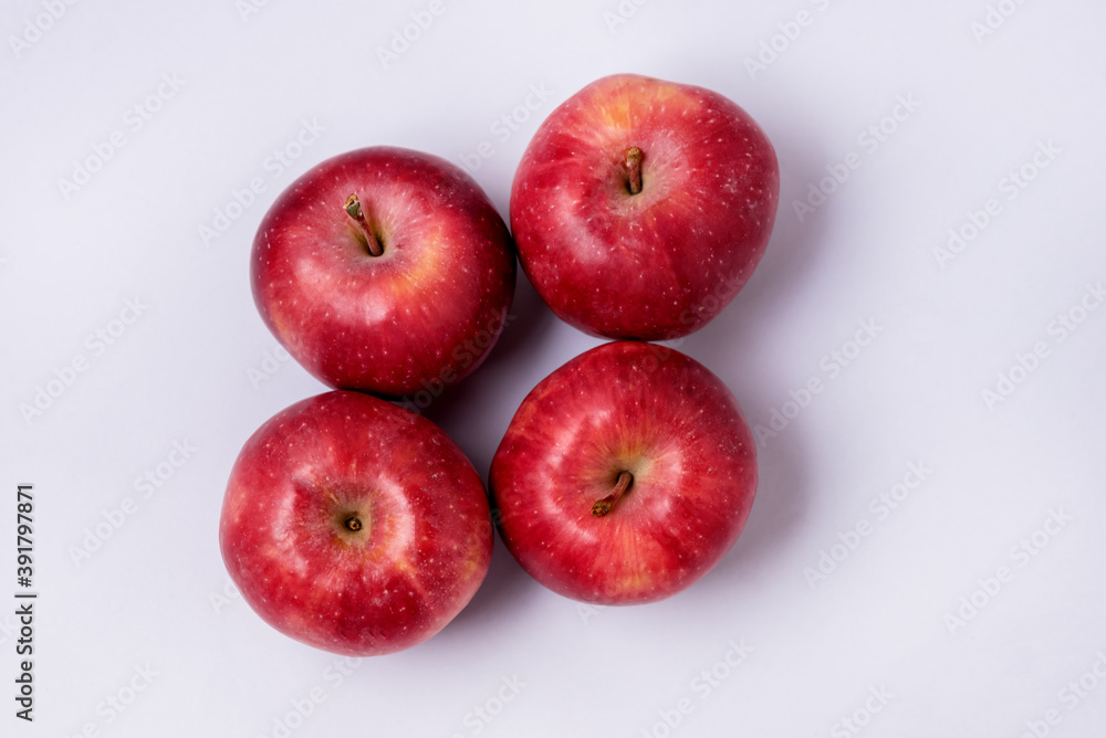 Four Tasty Red Apples on Blue Background Top View Horizontal Four Tasty Red Apples on Blue Background Top View Horizontal