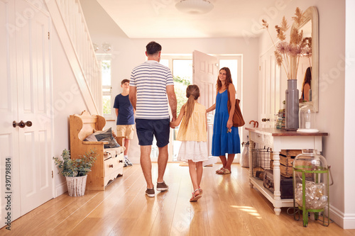 Family Leaving After Looking Around New Home Before They Move In