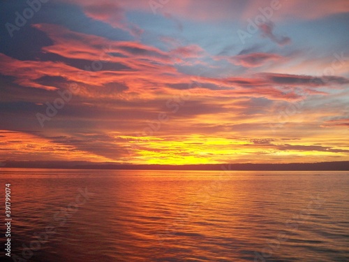 Fototapeta Naklejka Na Ścianę i Meble -  Beautiful sunrise at the high sea with a different colour in the sky
