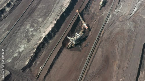 Rotation around of a mining quarry of coal or natural raw material. Bucket wheel excavator photo