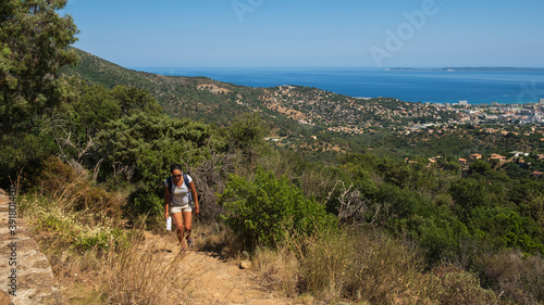 Girl hiking in the Provence countryside during the summer © Gnac49