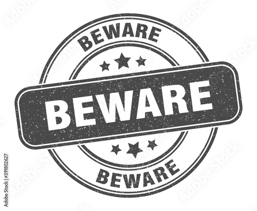 beware stamp. beware label. round grunge sign