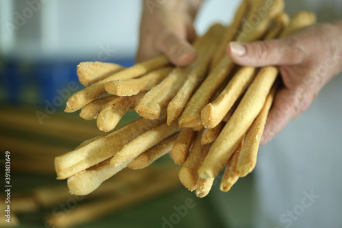 Fresh breadsticks out of the oven in Italy photo