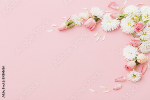 pink and white flowers on pink paper background © Maya Kruchancova