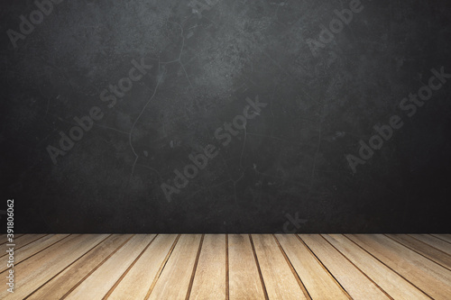 Empty room interior with wooden planks floor and black concrete wall, mockup, spot light