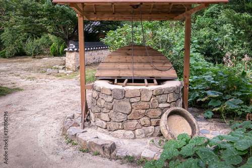 A Korean traditional well located in Yangdong Village, a UNESCO World Heritage Site in Gyeongju, South Korea. photo