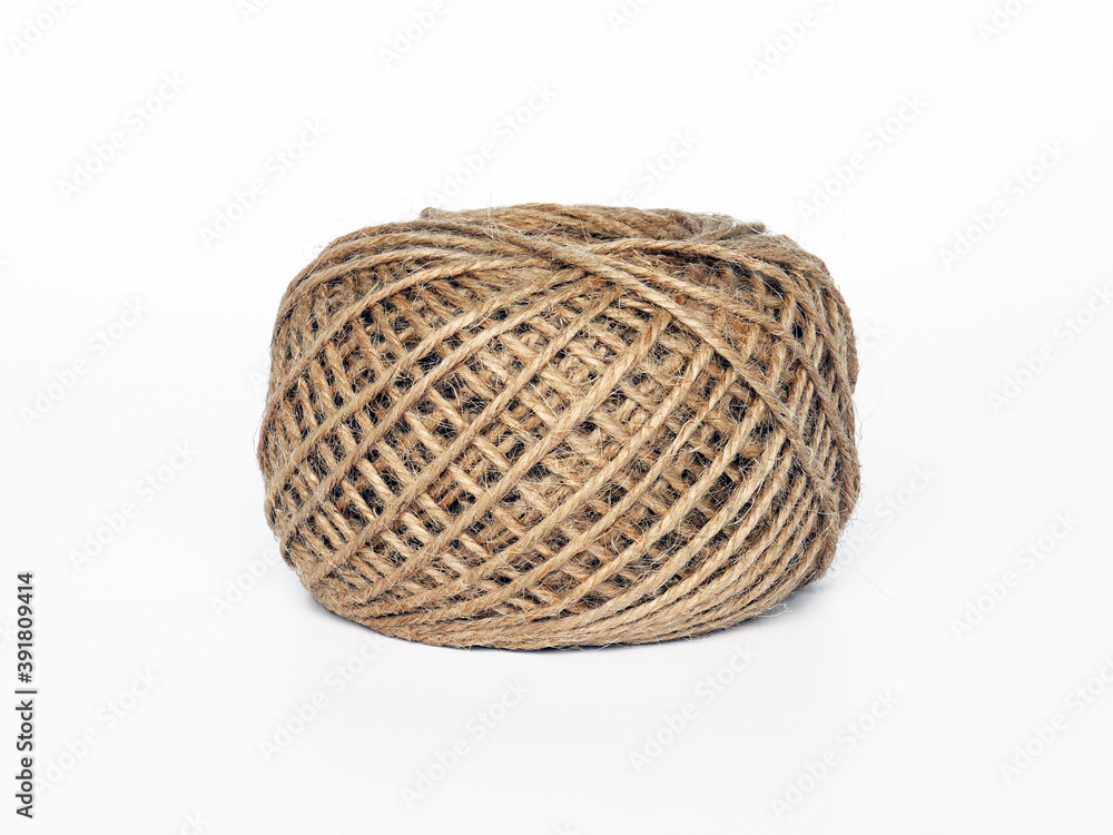 A coil of fine linen rope on a white background. A coil of fine linen rope on a white background.