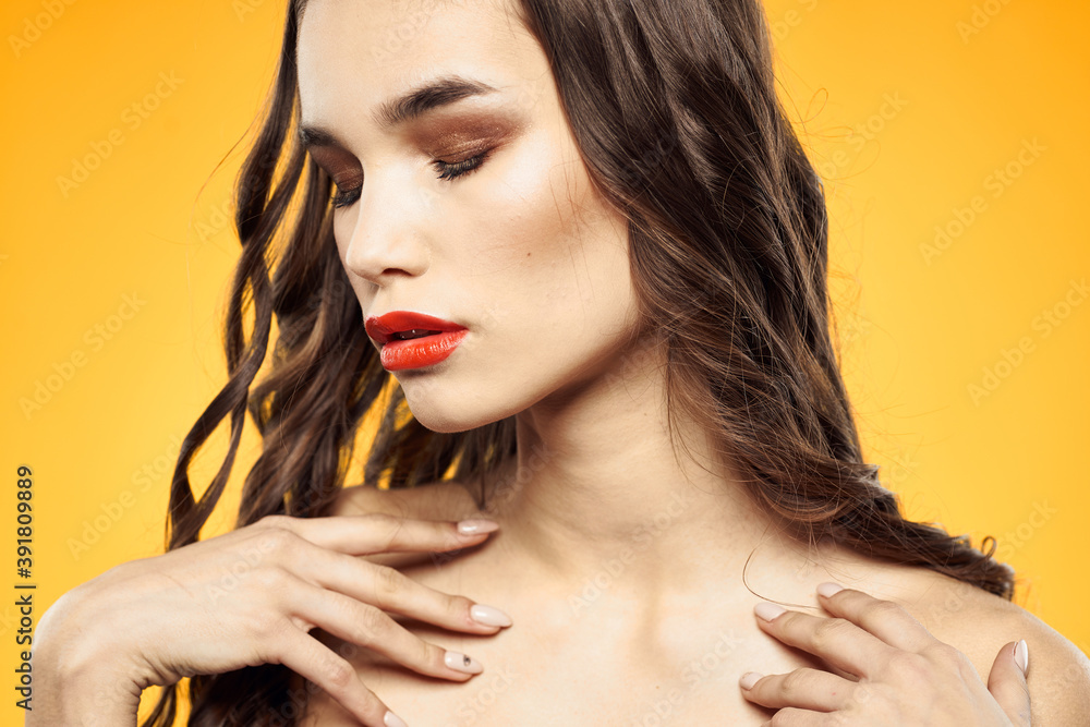 beautiful brunette red lips bare shoulders skin care yellow background beautiful brunette red lips bare shoulders skin care yellow background