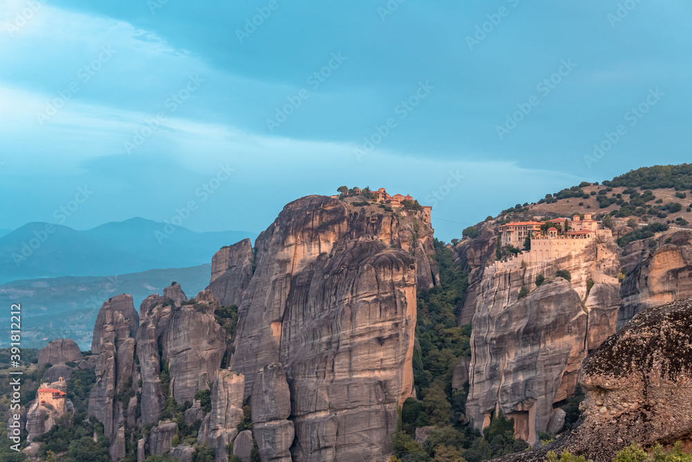 Panoramic sunrise view over monasteries and rock formations in Meteora, Thessaly, Greece