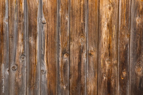 Texture of a wooden panel made of weathered and sun-burnt boards