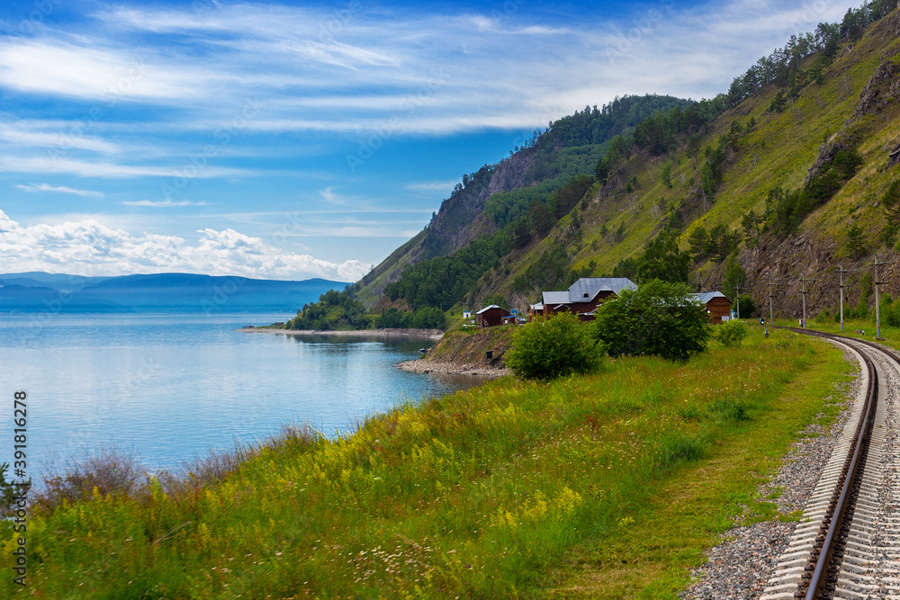 Circum-Baikal railway on the coastline Baikal lake. Summer landscape for transfer of an aura of wanderlust. Siberia, Russia