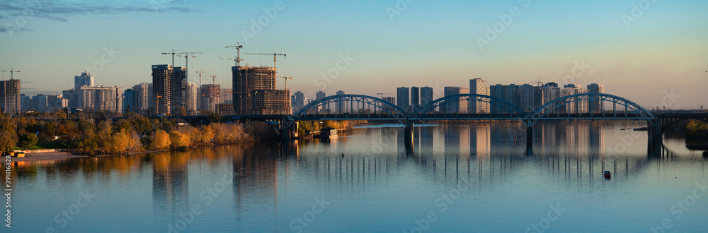 Nice autumn evening panorama of Dnipro river and Darnitsky bridge in Kiev Ukraine