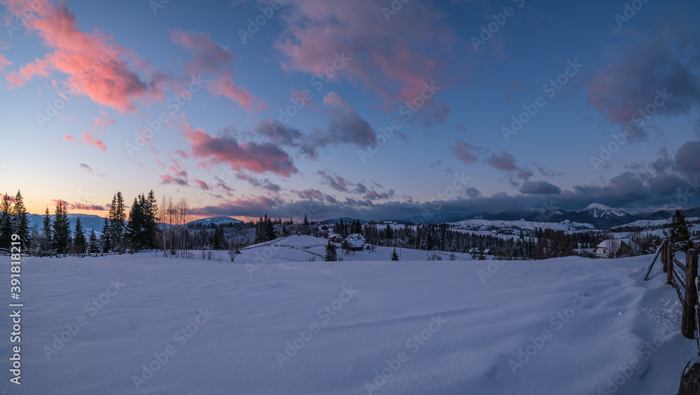 Winter sunset alpine tops  view from mountain village. Picturesque seasonal, nature and countryside beauty concept scene.