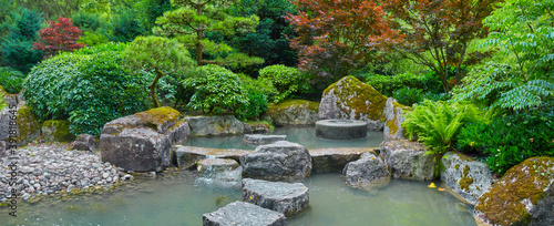 Εκτύπωση καμβά Beautiful Japanese garden with a pond in panorama format