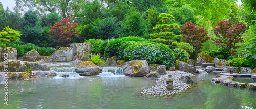 Canvas Print Beautiful Japanese garden with a pond in panorama format