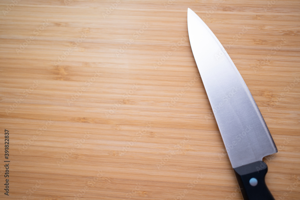 Knife on the background of a board for cutting a wooden Knife on the background of a board for cutting a wooden