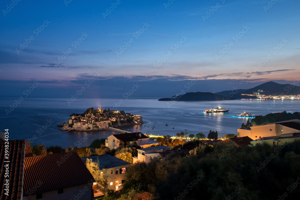 Fototapeta premium sunset over the mediterranean sea in Montenegro. Night view panorama island Sveti Stefan.