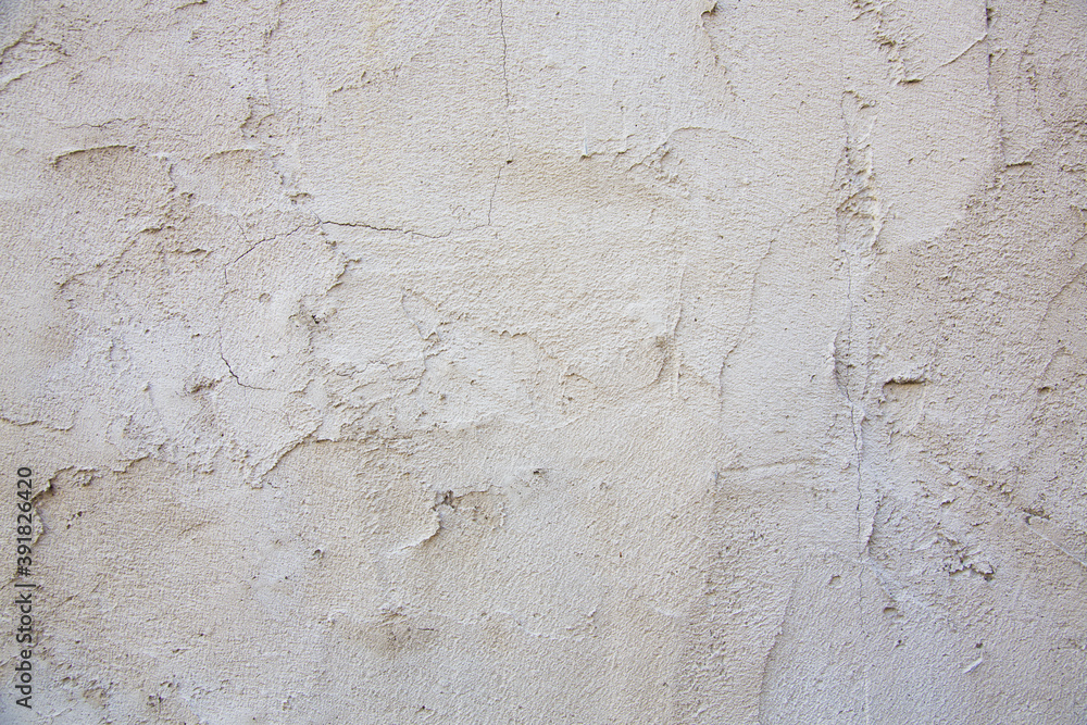 Old grungy cracked wall texture, brick plaster for background use.
