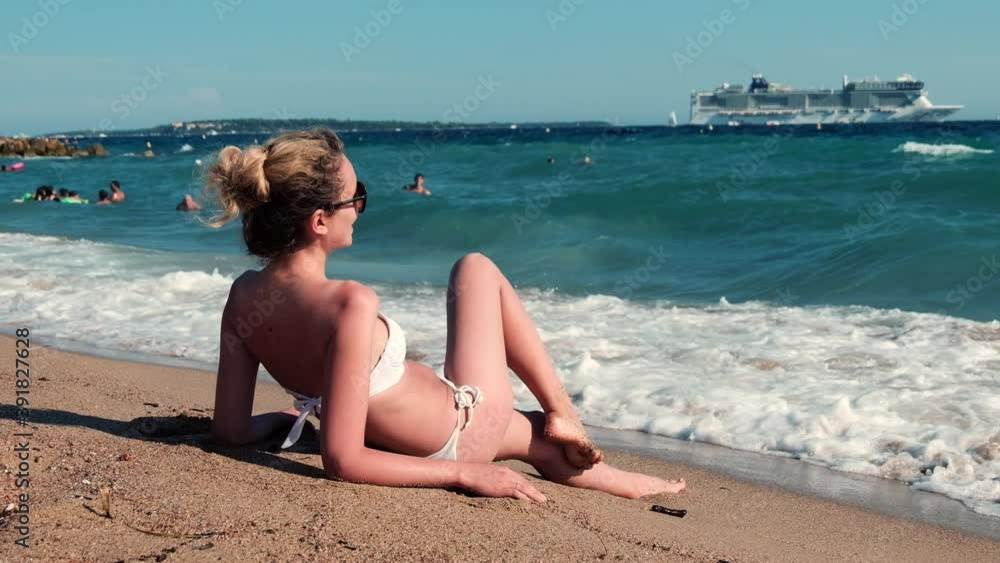 Woman enjoying the beach in Cannes, France