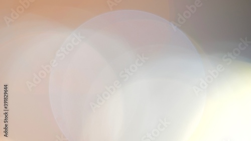 abstract background in light beige shades with circles of white, blue and orange colors