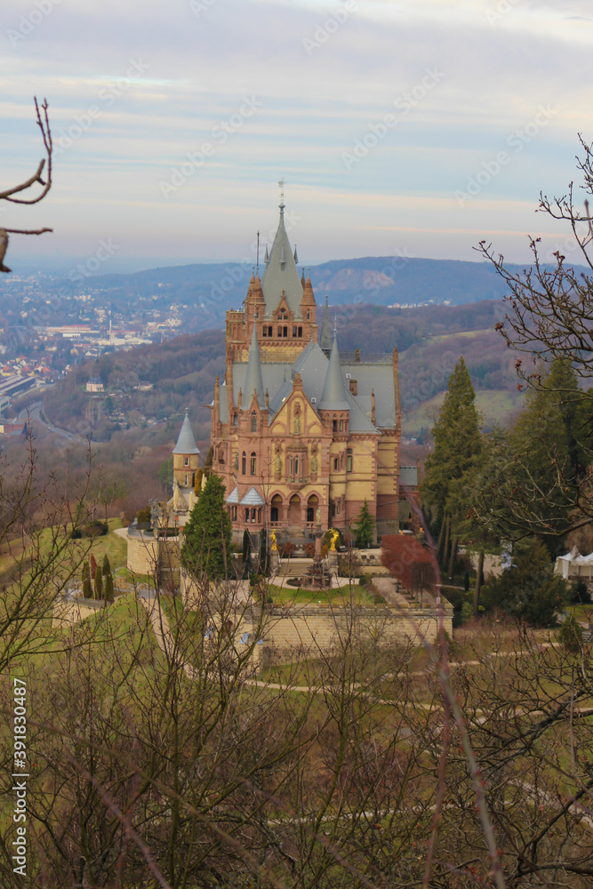 Overview of the Castle Drachenburg (Schloss Drachenburg) at the Drachenfels near Koenigswinter in Germany, with view over the Rhine to Bonn.