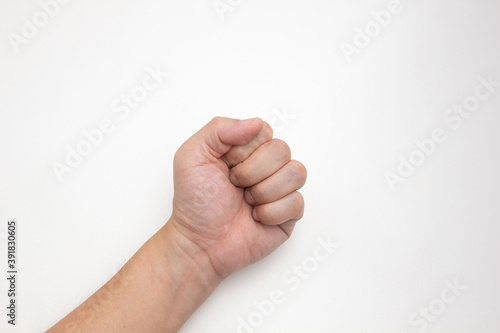The left hand of a white Asian man fisting or handful on white background.