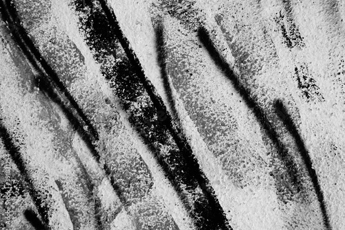 Abstract black and white background of old paint on the wall.Diagonal drawing .Monochrome.