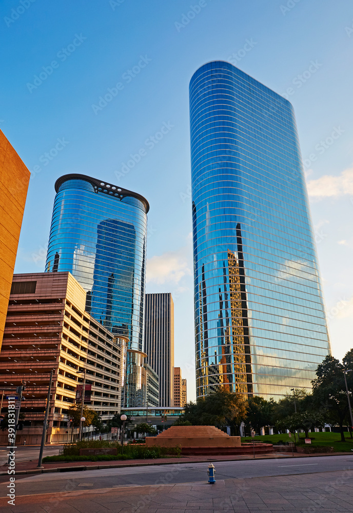 Postmodern skyscrapers (formerly Enron Towers) at 1400 Smith Street illuminated at dusk in Downtown Houston